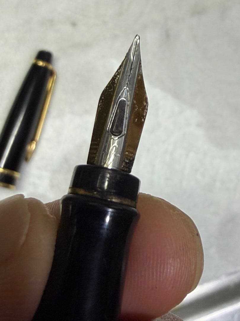 Waterman Paris black gold fountain pen with sleek design and gold accents on a white background