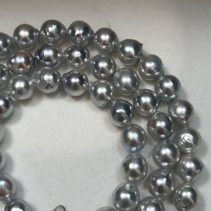 18K gold long necklace with 9mm Akoya blue pearls, 63cm length, weighing 59 grams