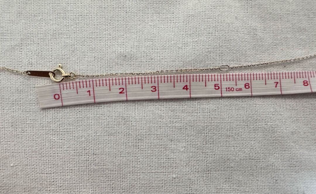 K10 Y-shaped necklace with detachable chain charm, 56 cm length, displayed on white background