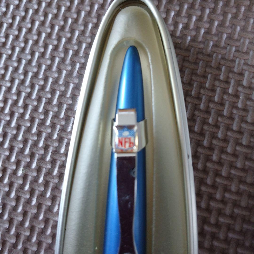 Blue Cross Morph ballpoint pen with NFL logo, metal case showing signs of age and wear