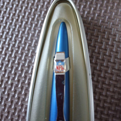 Blue Cross Morph ballpoint pen with NFL logo, metal case showing signs of age and wear