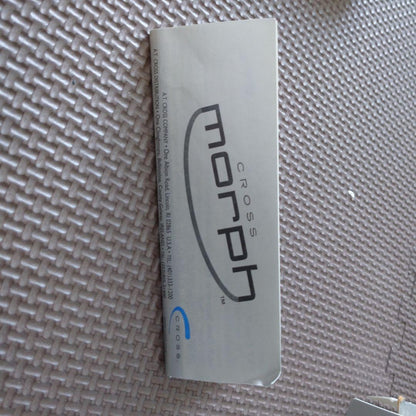 Blue Cross Morph ballpoint pen with NFL logo, metal case showing signs of age and wear