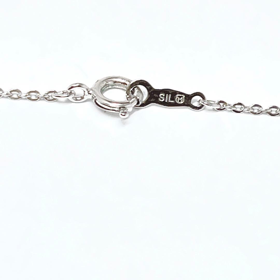 MIKIMOTO pearl necklace pendant in silver with 40.5 cm chain on white background