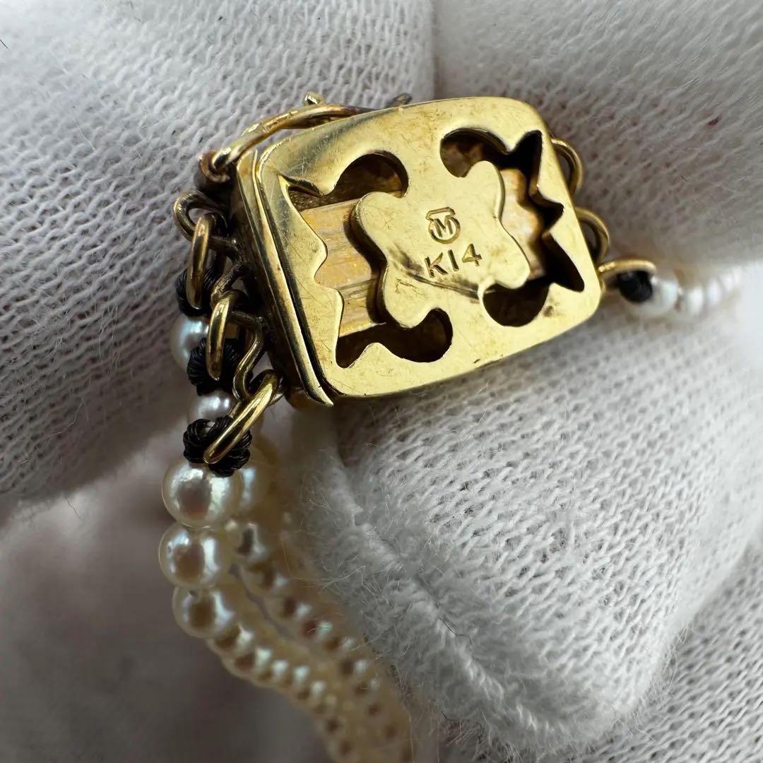 Law Mikimoto K14 yellow gold necklace with three rows of small 2.8mm Akoya baby pearls and Mikimoto clasp
