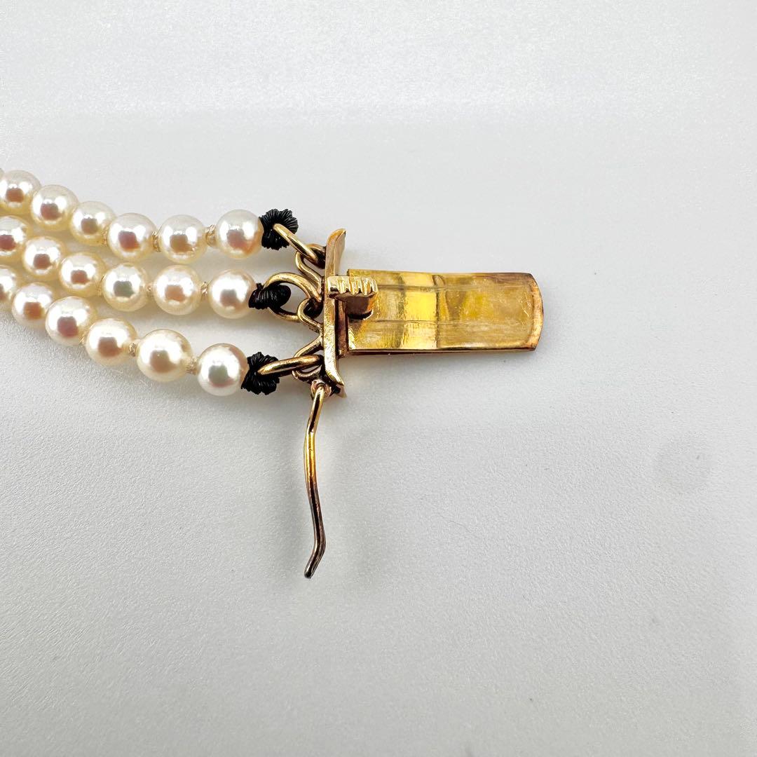 Law Mikimoto K14 yellow gold necklace with three rows of small 2.8mm Akoya baby pearls and Mikimoto clasp