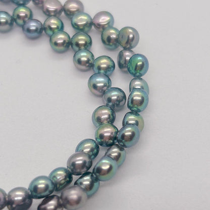 Pearl Necklace 64 featuring black aurora pearls and a K14 white gold clasp, 40cm length
