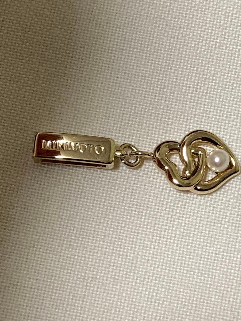 Mikimoto Baby Pearl Heart Pendant in silver with gold 3.5mm pearl, 31mm length, delicate heart shape