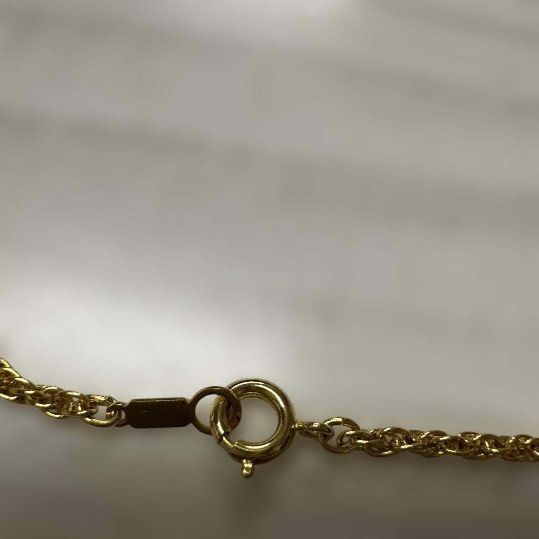 Mikimoto Pearl Loupe Necklace featuring a real pearl pendant on a delicate chain in used condition