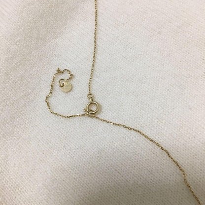 Jewelry Tsutsumi South Sea white butterfly pearl necklace with 12.5mm pearls on a white background