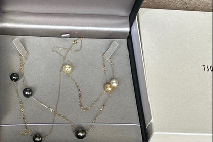 Jewelry Tsutsumi South Sea white butterfly pearl necklace with 12.5mm pearls on a white background