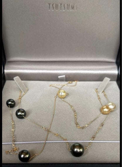 Jewelry Tsutsumi South Sea white butterfly pearl necklace with 12.5mm pearls on a white background