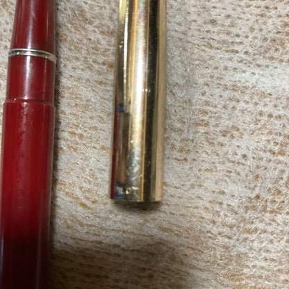 Vintage 14k PILOT SUPER100s fountain pen with gold cap and Bordeaux barrel showing inset nib