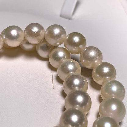 Akoya pearl necklace featuring round white pearls sized 8.5 to 8.8 mm on a 17-inch silver chain