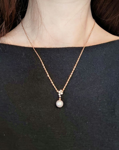TASAKI Pearl Necklace featuring 8mm pearl, 18K gold chain, and diamond accents, approximately 40cm long