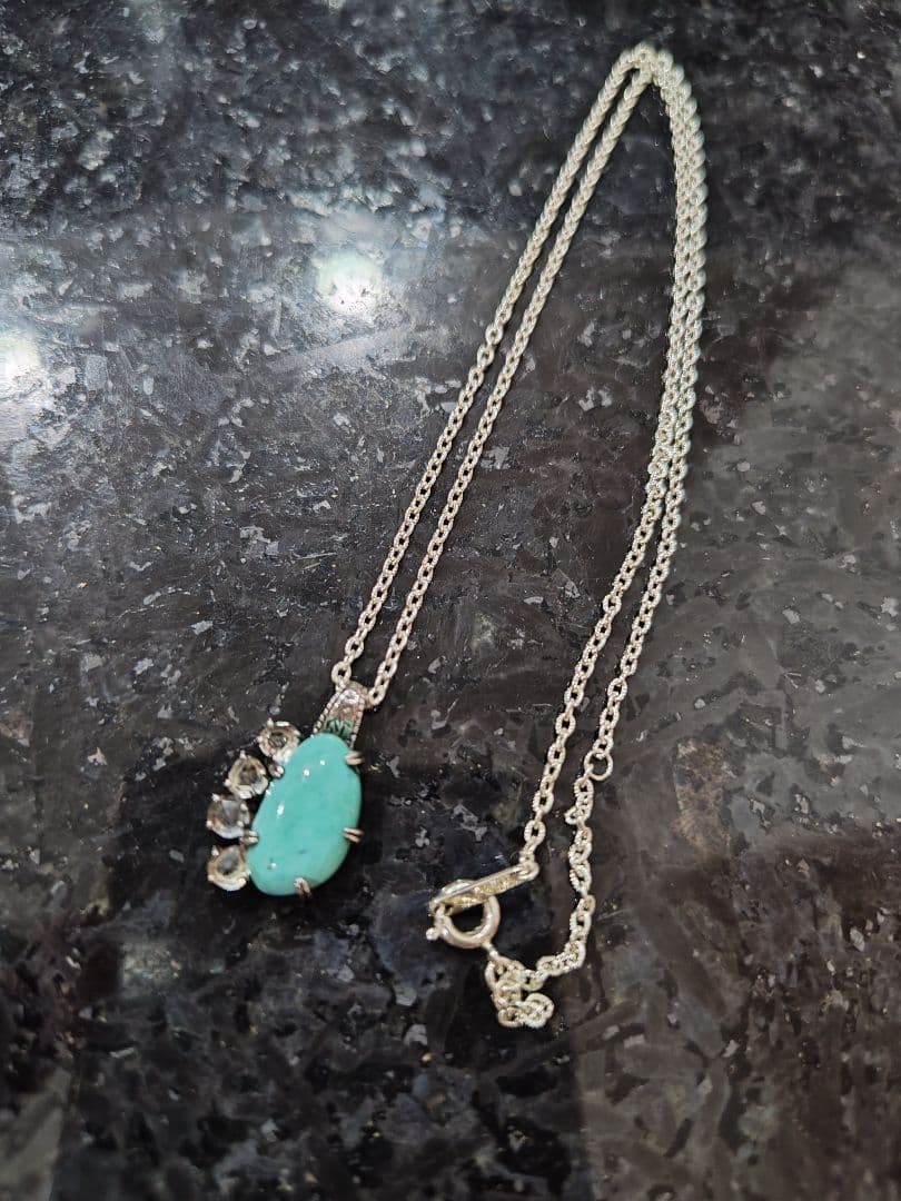 Agete silver necklace with turquoise stone and clear white topaz decorations on a delicate chain