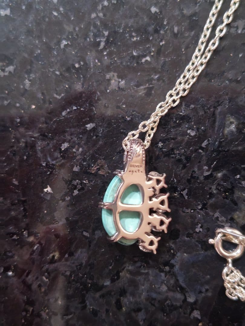 Agete silver necklace with turquoise stone and clear white topaz decorations on a delicate chain