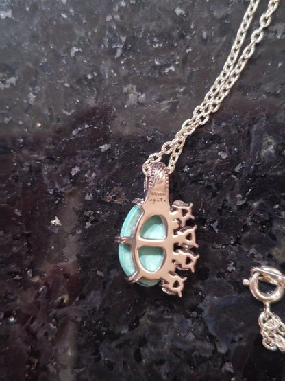 Agete silver necklace with turquoise stone and clear white topaz decorations on a delicate chain