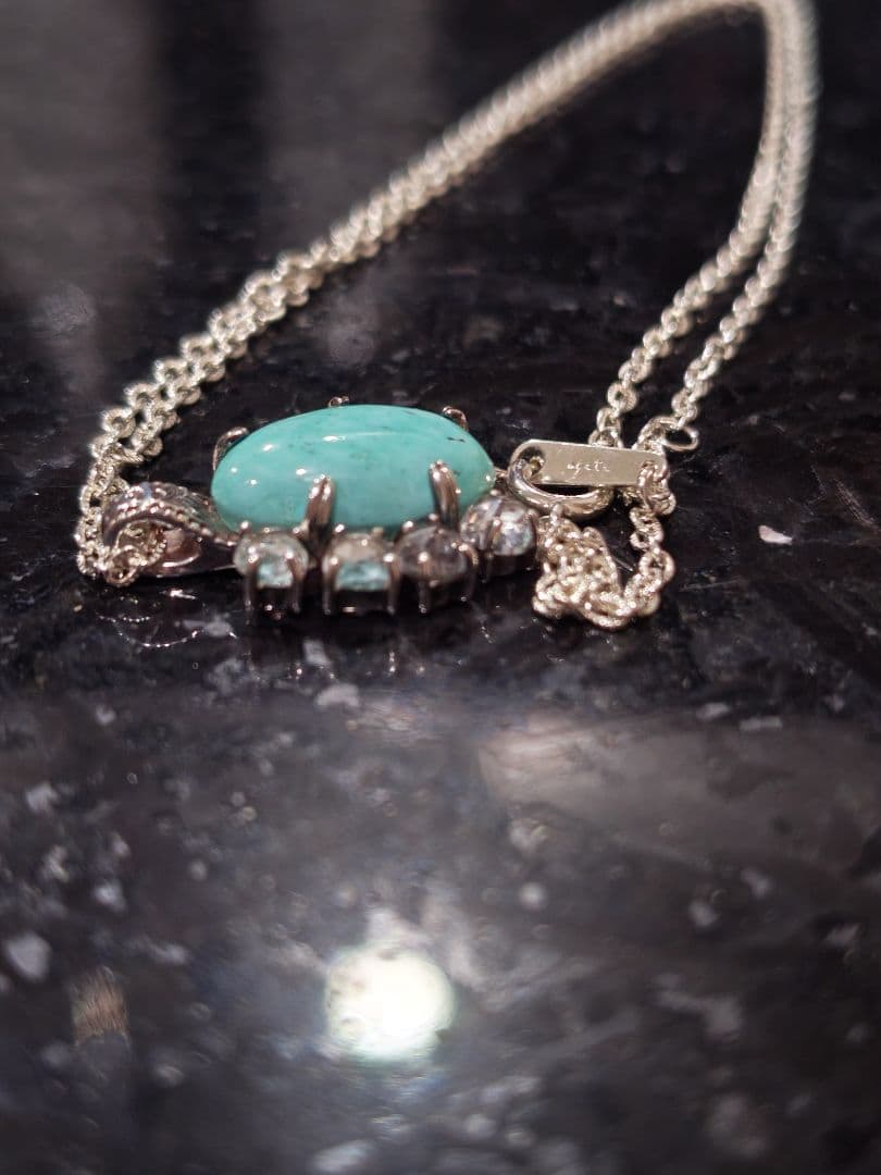 Agete silver necklace with turquoise stone and clear white topaz decorations on a delicate chain