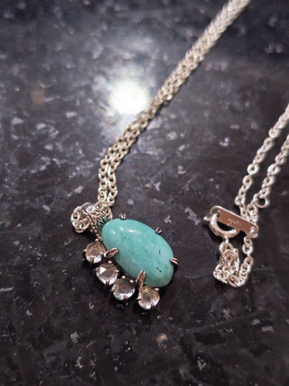 Agete silver necklace with turquoise stone and clear white topaz decorations on a delicate chain