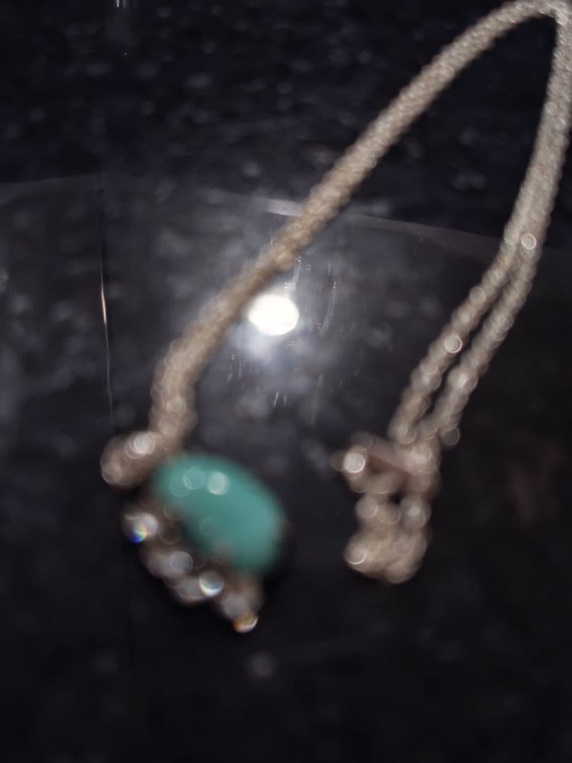 Agete silver necklace with turquoise stone and clear white topaz decorations on a delicate chain