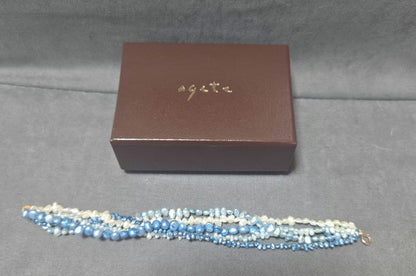 ageté K10 3-piece set with blue and white freshwater pearl necklace, bracelet, and earrings made of stone