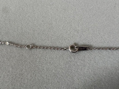 Mikimoto single pearl necklace with 6mm pearl and 40cm silver chain on white background