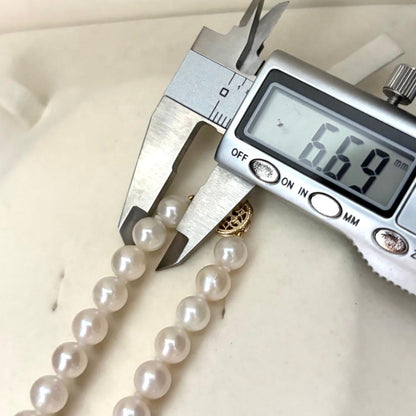 Akoya pearl necklace with 7.0mm white natural pearls on 43cm chain featuring 14KG clasp and strong luster