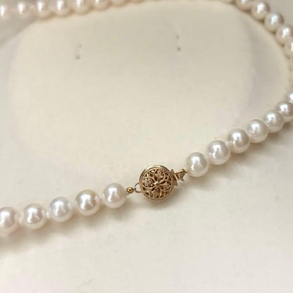 Akoya pearl necklace with 7.0mm white natural pearls on 43cm chain featuring 14KG clasp and strong luster