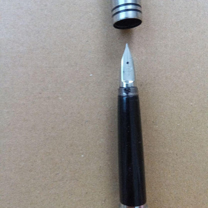Vintage Pilot fountain pen over 40 years old with black barrel and silver trim