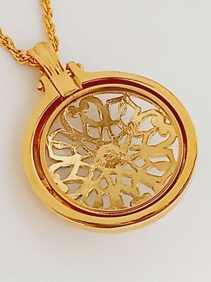 Mikimoto pendant necklace featuring a gold and silver pendant with magnifier on a 64 cm gold chain