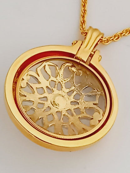 Mikimoto pendant necklace featuring a gold and silver pendant with magnifier on a 64 cm gold chain