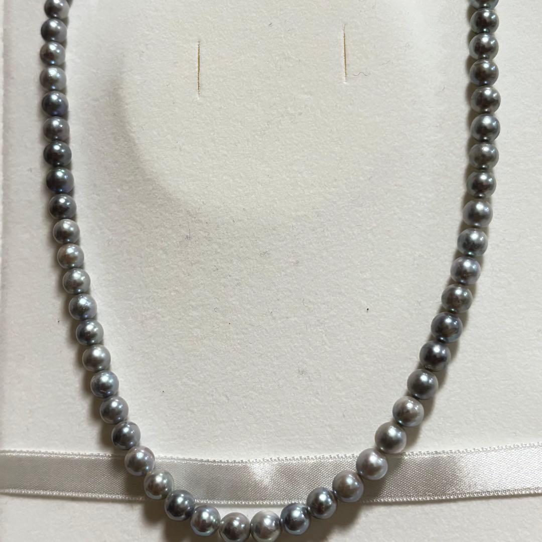 Akoya pearl necklace featuring 6-7mm pearls with a silver lock clasp, 42 cm long