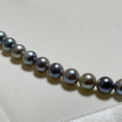 Akoya pearl necklace featuring 6-7mm pearls with a silver lock clasp, 42 cm long