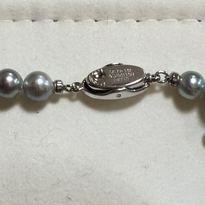 Akoya pearl necklace featuring 6-7mm pearls with a silver lock clasp, 42 cm long