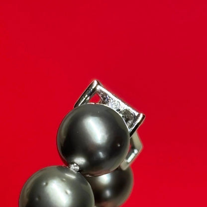 Tasaki Black Pearl Necklace featuring 9.0-11.0 mm pearls with a 41 cm length