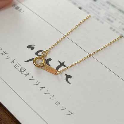 agete K18YG yellow gold diamond cross necklace with reversible milgrain design on a white background