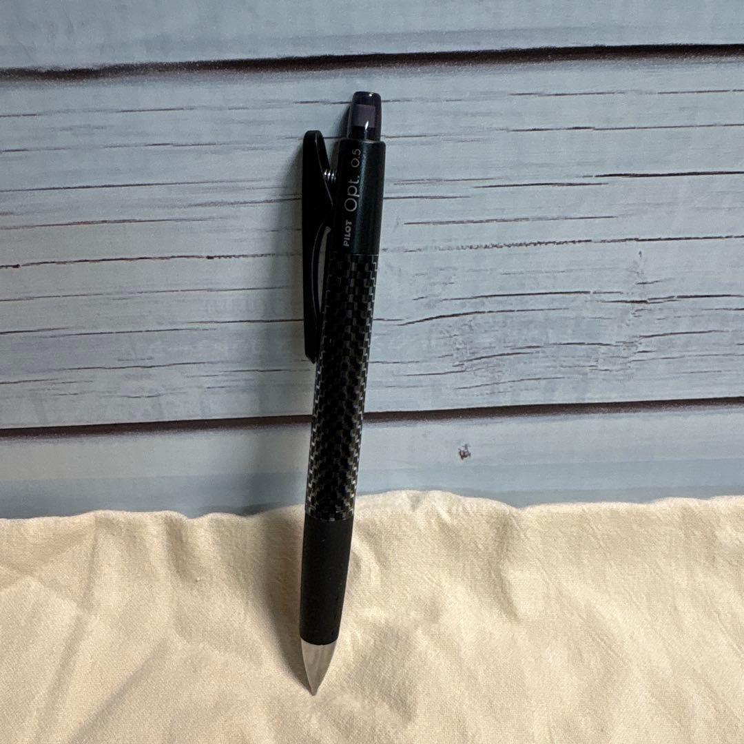 Set of 10 PILOT Opt.6 black mechanical pencils made of carbon fiber shown in a neat arrangement