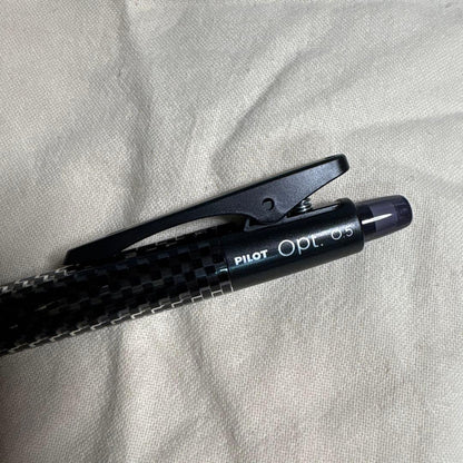 Set of 10 PILOT Opt.6 black mechanical pencils made of carbon fiber shown in a neat arrangement