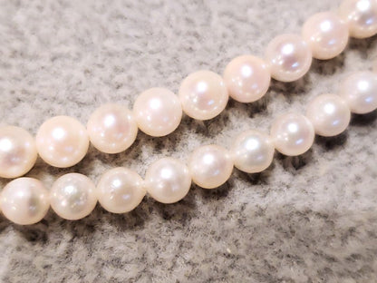 Akoya baby pearl necklace with 4mm white pearls and blue Akoya pearl necklace with 5mm deep blue pearls