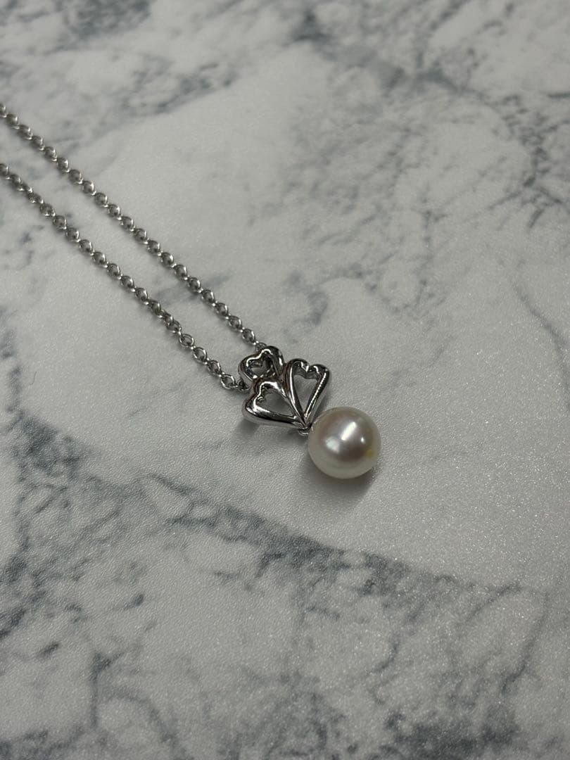 TASKA 7.1mm Akoya pearl necklace with silver mark on 40cm chain displayed on white background