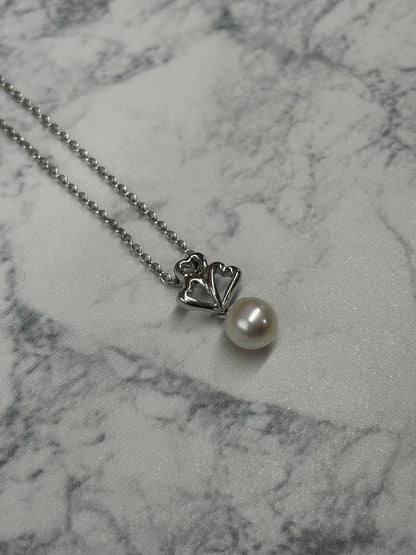 TASKA 7.1mm Akoya pearl necklace with silver mark on 40cm chain displayed on white background