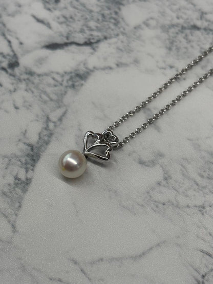 TASKA 7.1mm Akoya pearl necklace with silver mark on 40cm chain displayed on white background