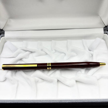 Vintage Waterman ballpoint pen with brown marble pattern and gold accents, rotary mechanism, made in France