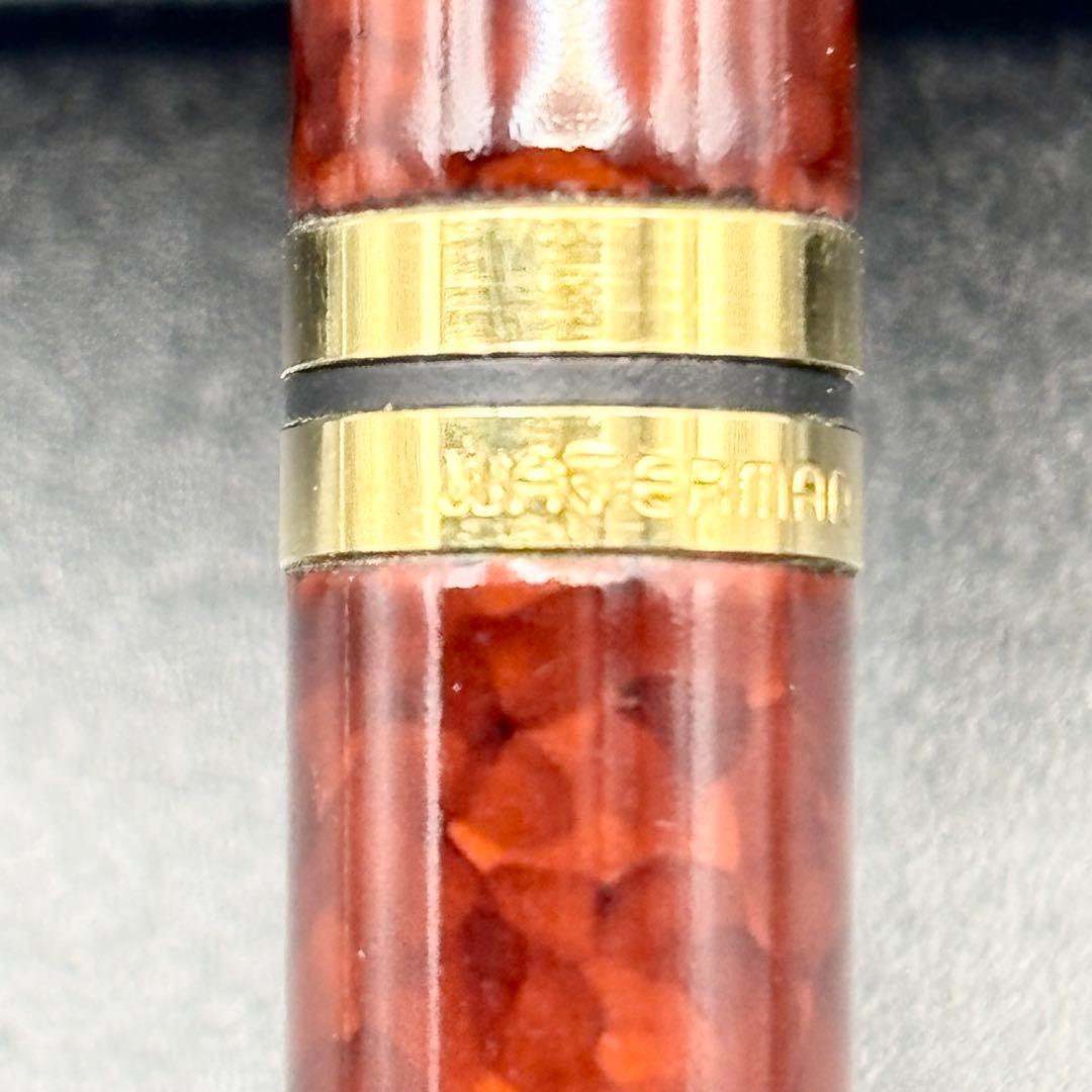 Vintage Waterman ballpoint pen with brown marble pattern and gold accents, rotary mechanism, made in France