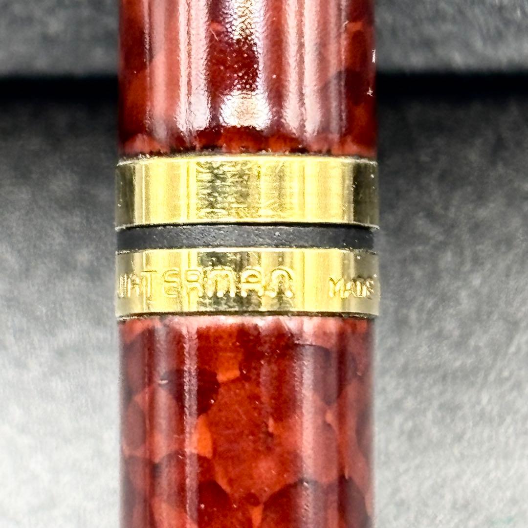 Vintage Waterman ballpoint pen with brown marble pattern and gold accents, rotary mechanism, made in France