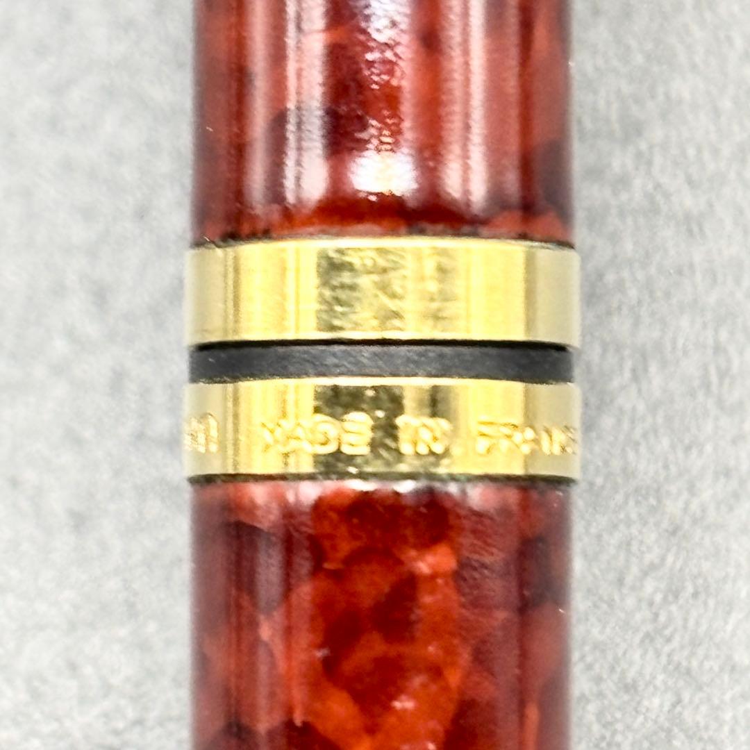 Vintage Waterman ballpoint pen with brown marble pattern and gold accents, rotary mechanism, made in France