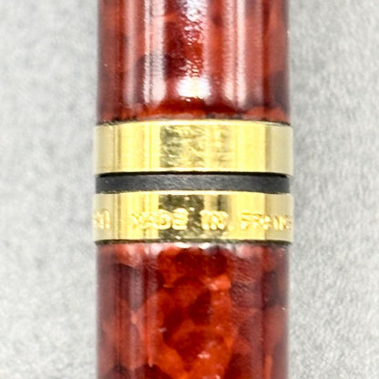 Vintage Waterman ballpoint pen with brown marble pattern and gold accents, rotary mechanism, made in France