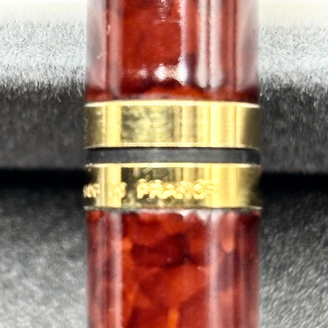 Vintage Waterman ballpoint pen with brown marble pattern and gold accents, rotary mechanism, made in France