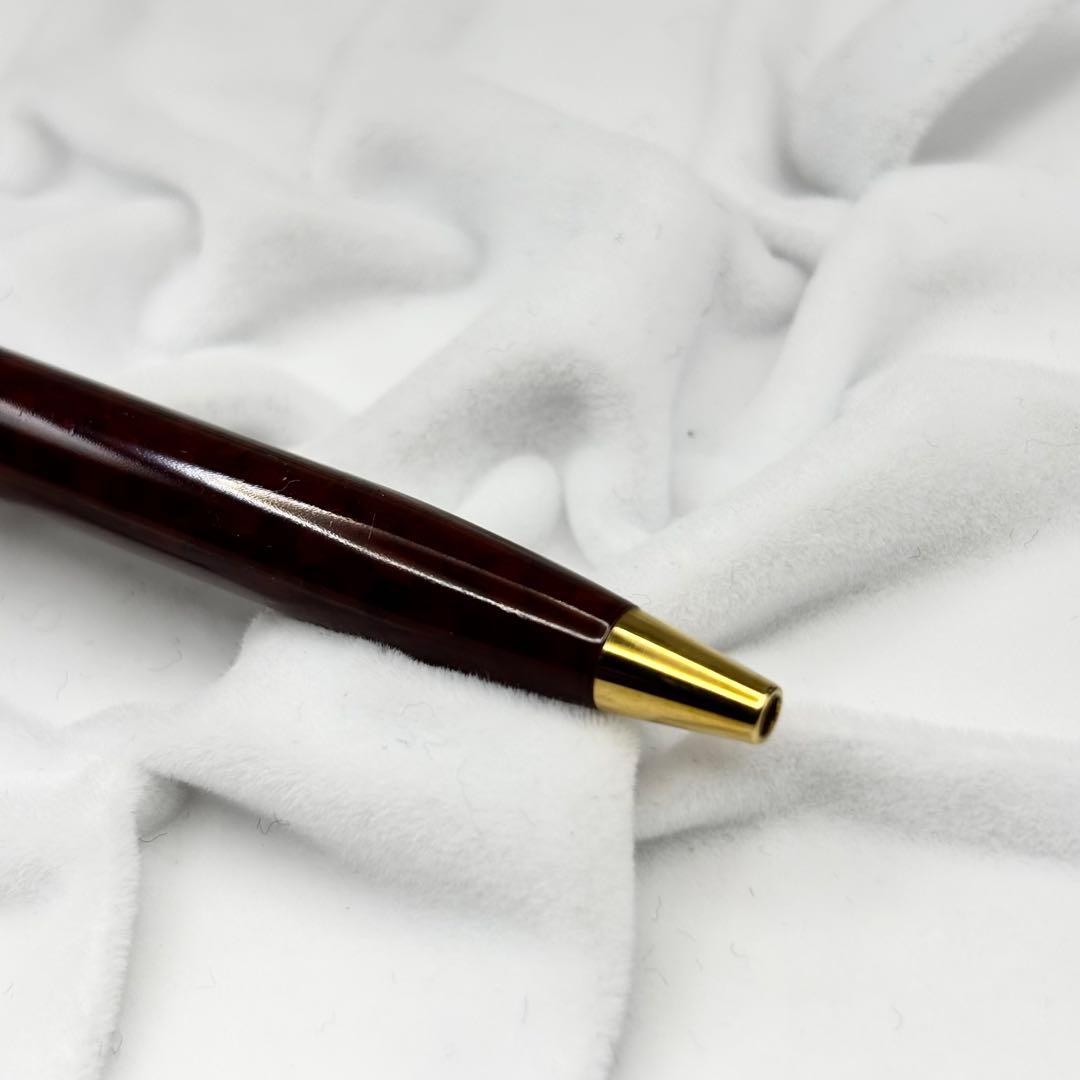 Vintage Waterman ballpoint pen with brown marble pattern and gold accents, rotary mechanism, made in France