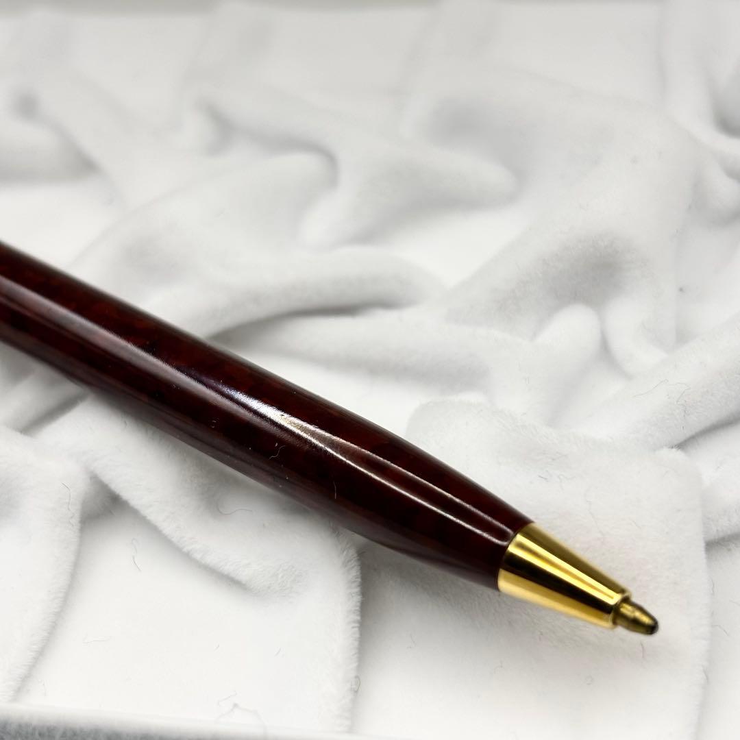 Vintage Waterman ballpoint pen with brown marble pattern and gold accents, rotary mechanism, made in France